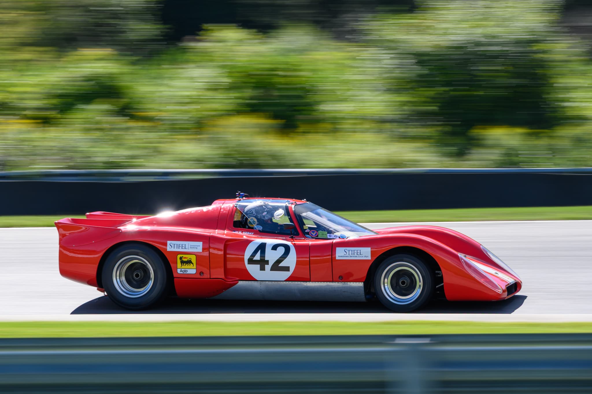 Blue Porsche 356 with hand resting on steering wheel — automotive detail photography