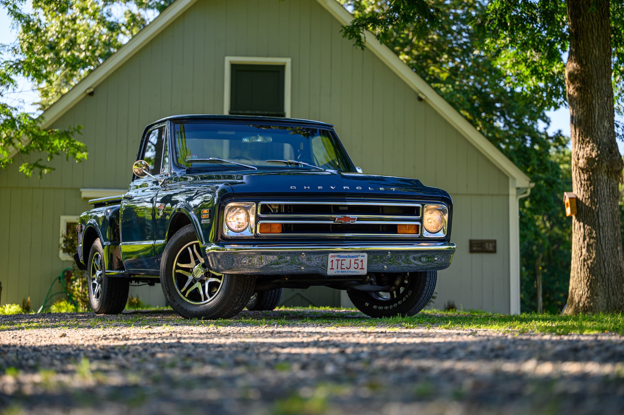 1955 Chevrolet Nomad framed through New England fall foliage — collector car photography
