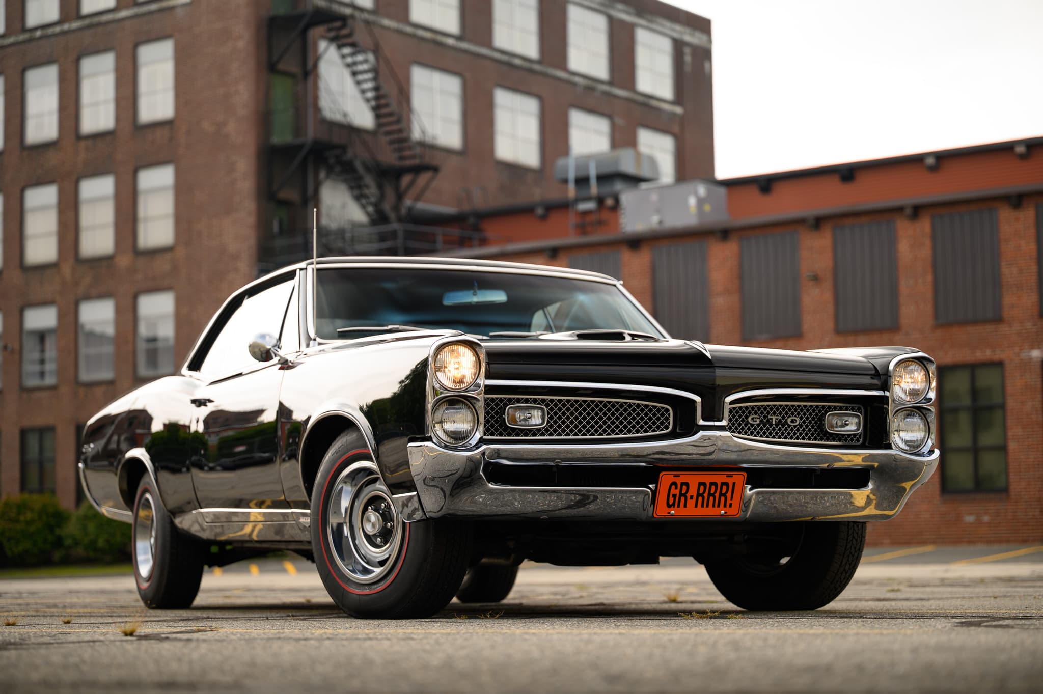 1967 Pontiac GTO in an industrial setting — BaT auction photography Boston