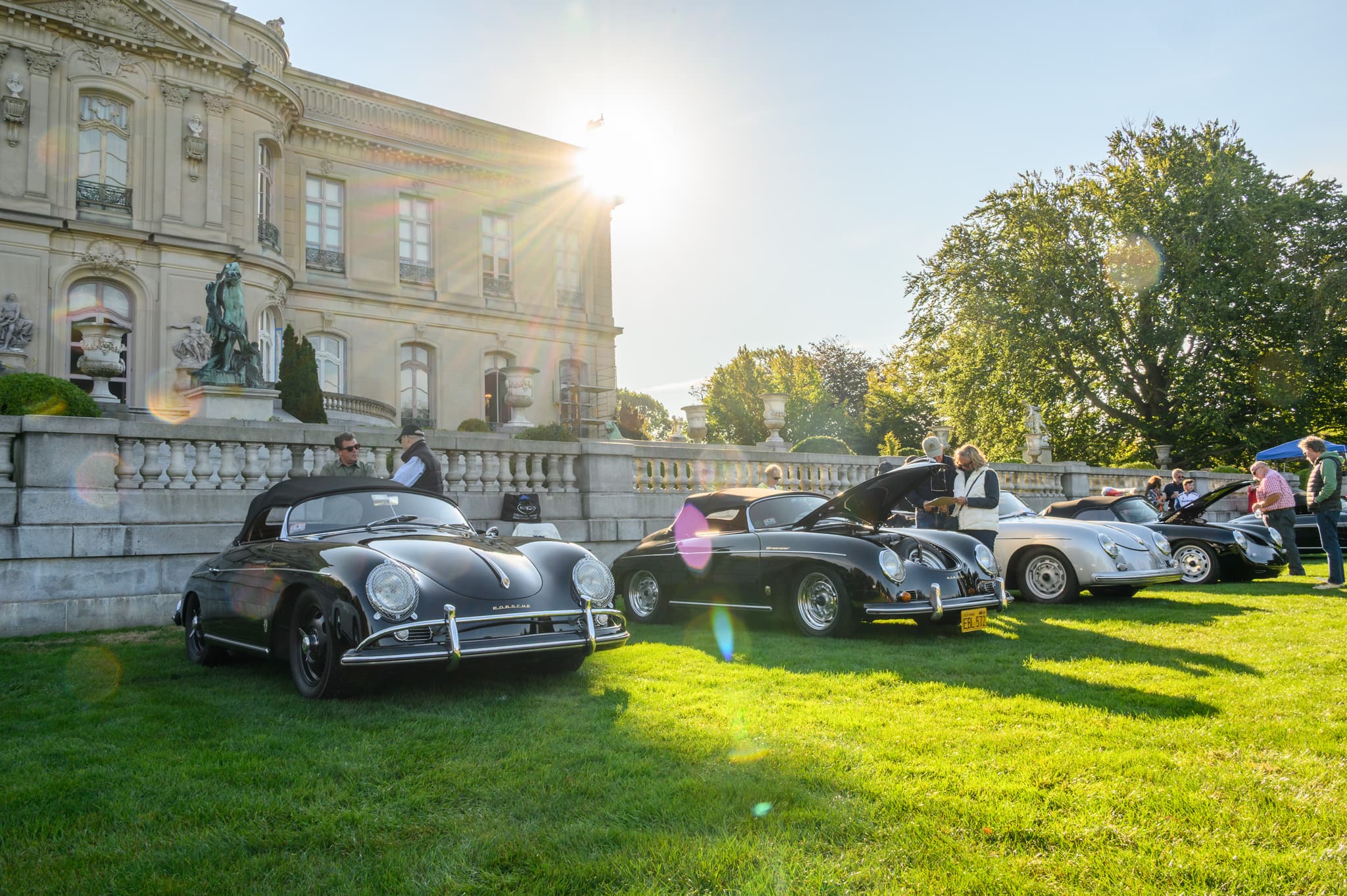 Two Porsche 356 Speedsters against a Newport sunburst — automotive photography New England
